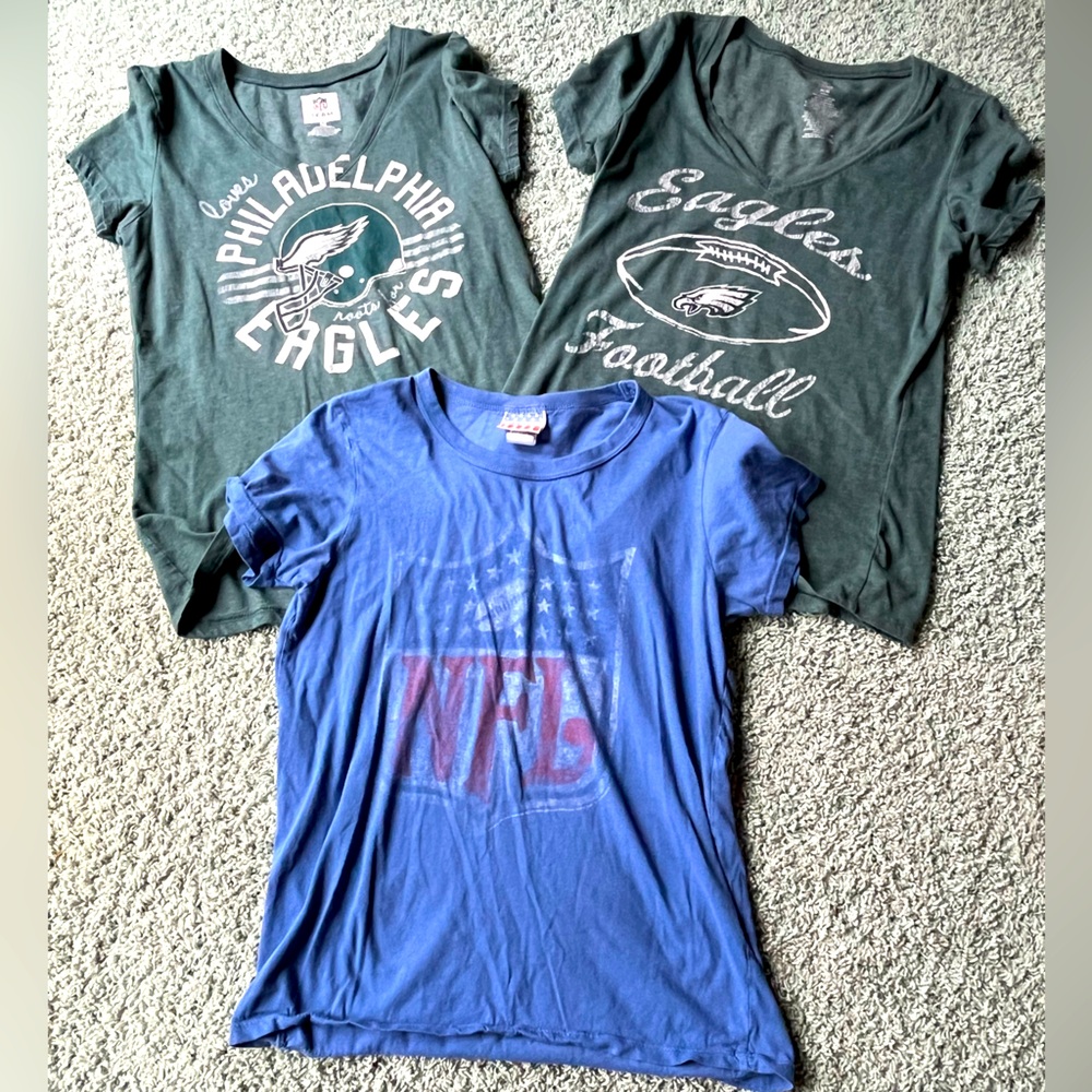 Three NFL short sleeve shirts - two are Philadelphia Eagles.  Size Med